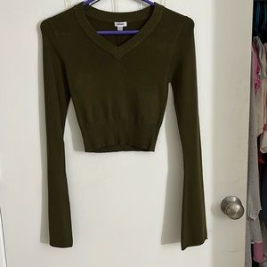 dark green sweater with bell sleeves